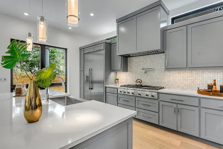 Remodeled kitchen with gray cabinets