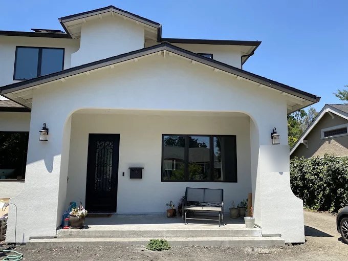Finished white stucco front porch